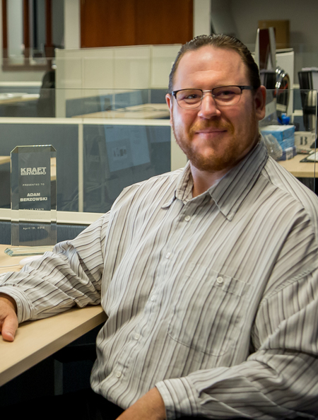 Adam Berzowski at his desk