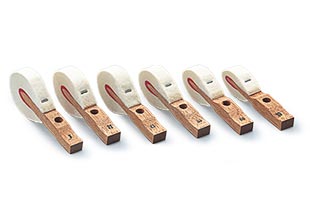 six piano key weights arranged left to right from heaviest to lightest