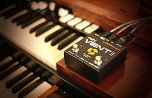 Neo Instruments Mini Vent II perched on dual manual organ